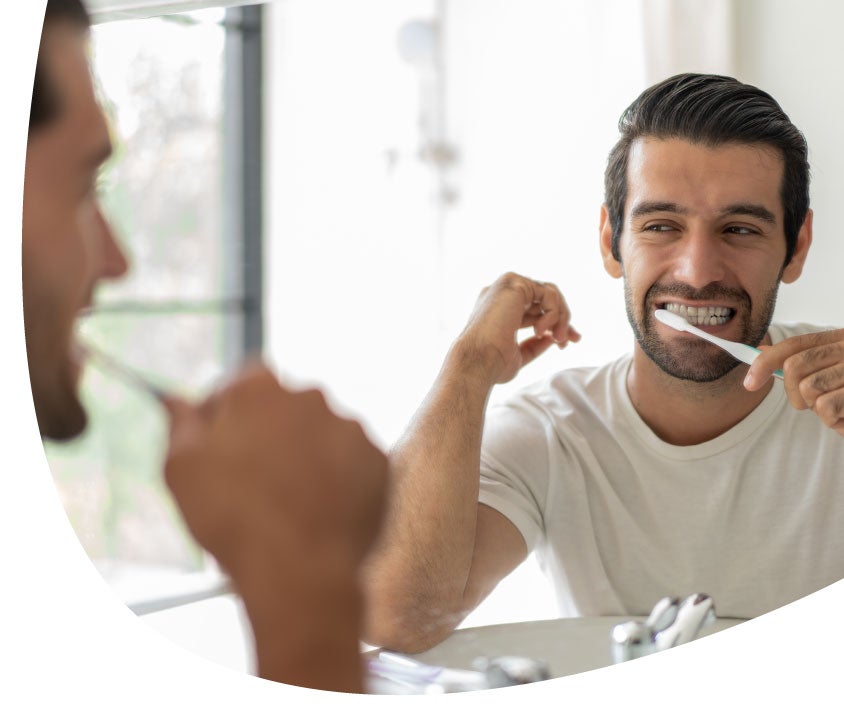 man brushing teeth