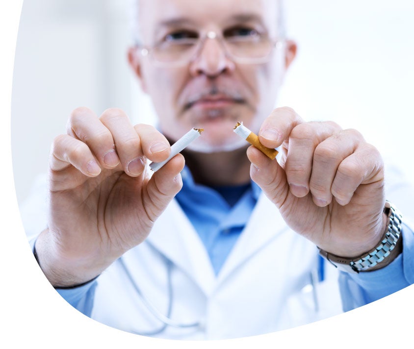 Doctor breaking a cigarret